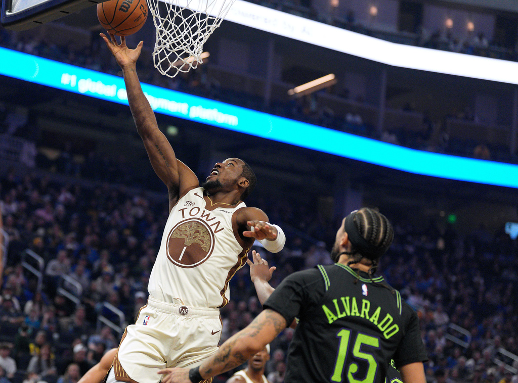 Golden State Warriors forward Jonathan Kuminga (1) shoots against New Orleans Pelicans guard Jose Alvarado (15) during the first half of an NBA basketball game in San Francisco, Saturday, Nov. 29, 2025. (AP Photo/Tony Avelar)