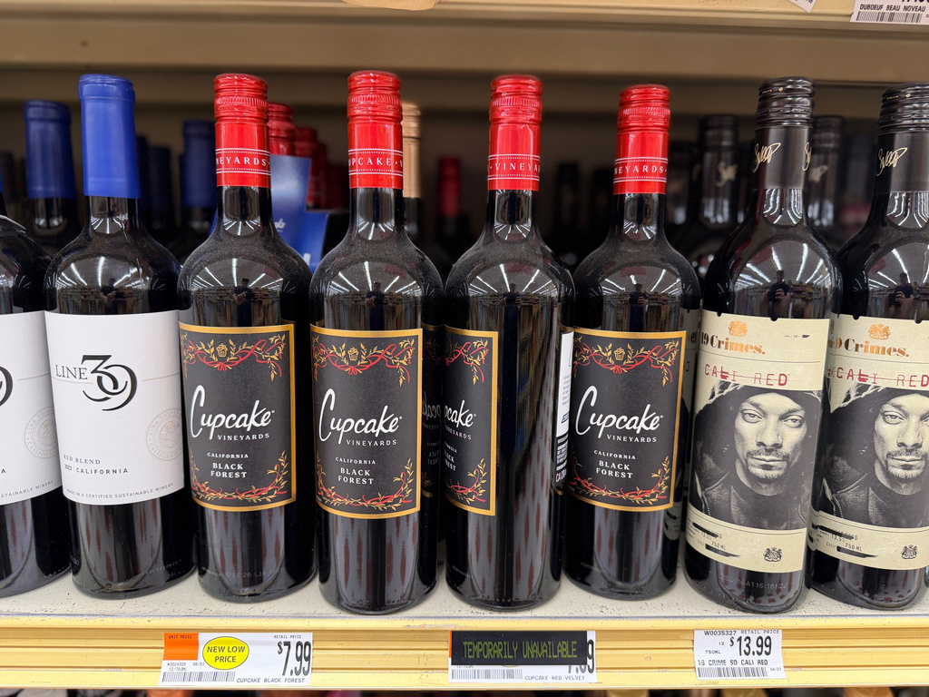 A variety of California red wines from Line 39, from left, Cupcake Vineyards and Snoop Dogg's 19 Crimes Cali Red, are displayed at a grocery store in Concord, N.H. on June 8, 2026. (J.M. Hirsch via AP)