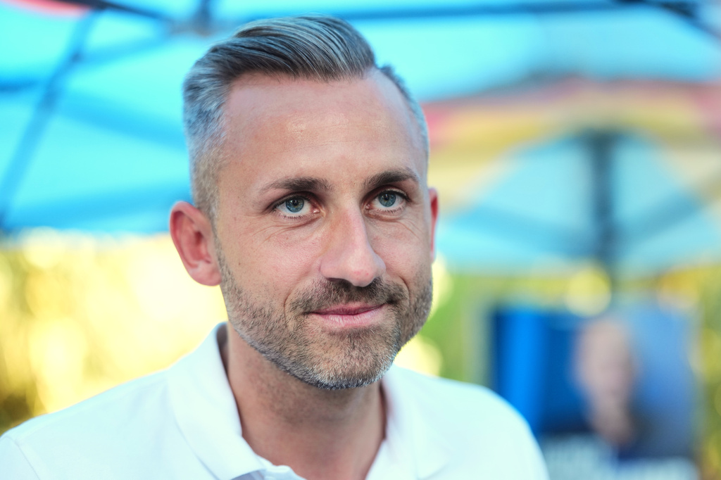 Ulrich Sigmund, the top candidate for the "Alternative for Germany" (AfD) party in the state elections in Saxony-Anhalt, speaks to The Associated Press at a campaign barbecue hosted by the party in Moeser, Germany, Thursday, Aug. 13, 2026. (AP Photo/Markus Schreiber)