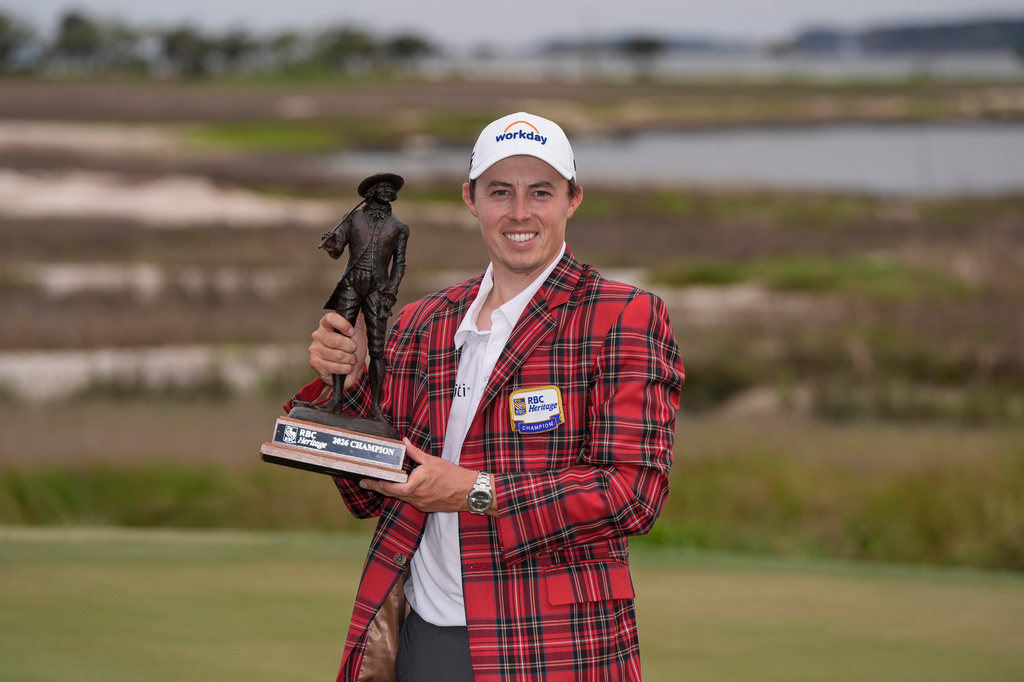 Matt Fitzpatrick, of England, poses with the trophy after winning the RBC Heritage golf tournament Sunday, April 19, 2026, in Hilton Head, S.C. (AP Photo/Mike Stewart)