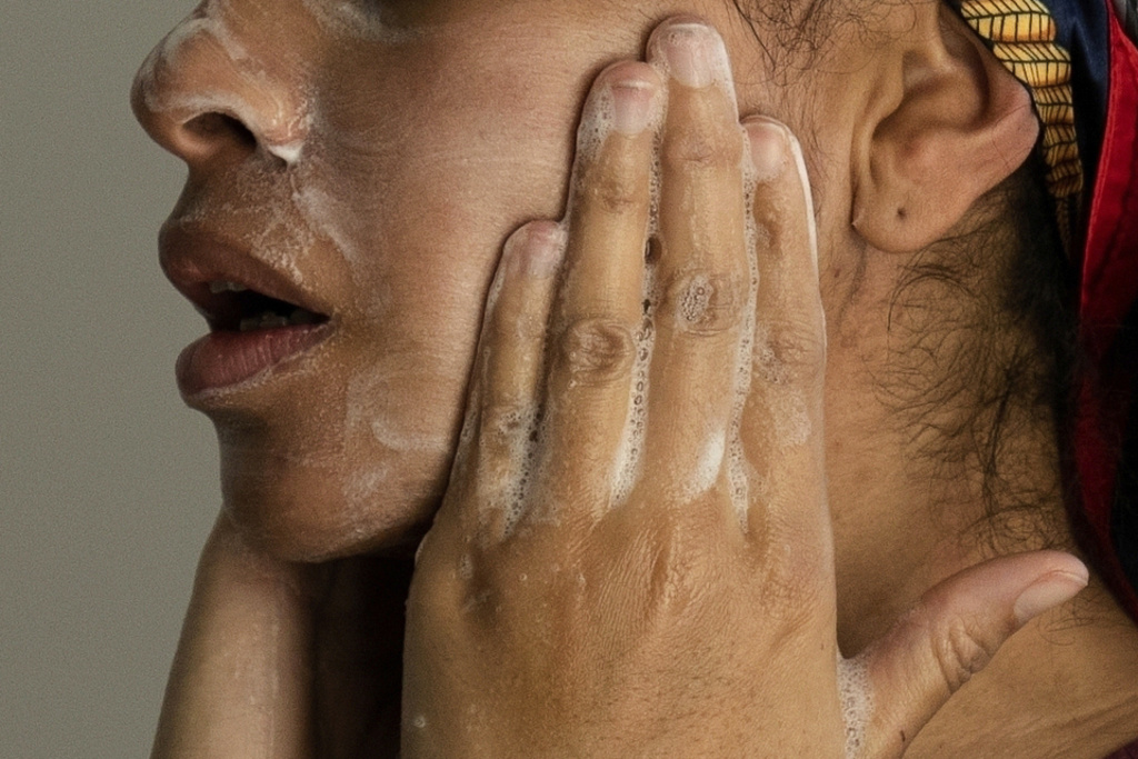 FILE - A woman washes her face as she prepares for work in Chicago, on Friday, Feb. 10, 2023. (AP Photo/Erin Hooley, File)