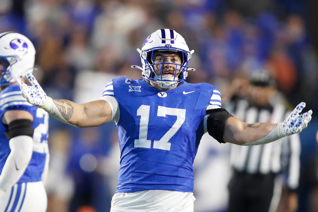 BYU linebacker Jack Kelly (17) gestures to the crowd during the second half of an NCAA college football game against TCU, Saturday, Nov. 15, 2025, in Provo, Utah. (AP Photo/George Frey)