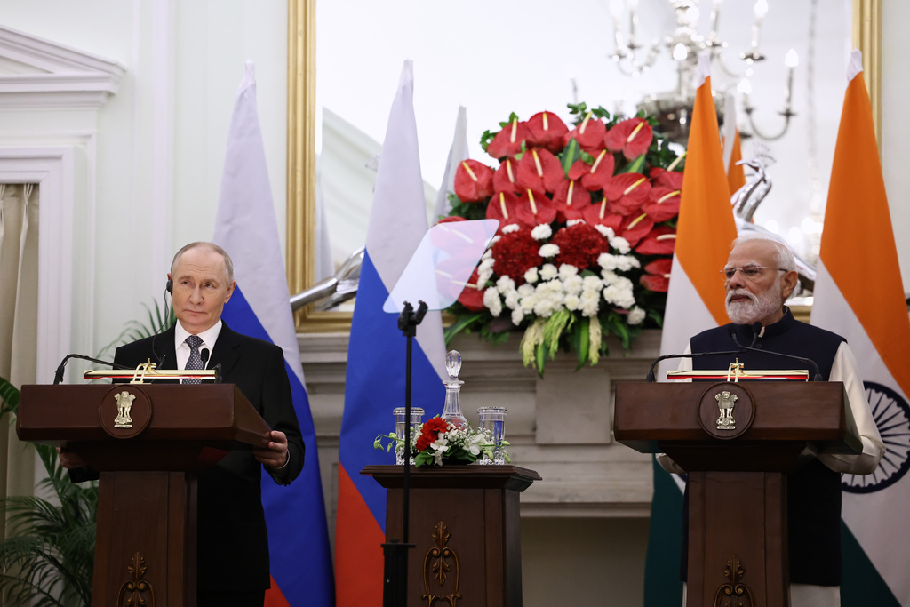 Russian President Vladimir Putin, left, and Indian Prime Minister Narendra Modi make a press statement after their talks at the Hyderabad House in New Delhi, India, Friday, Dec. 5, 2025. (Alexander Kazakov, Sputnik, Kremlin Pool Photo via AP)