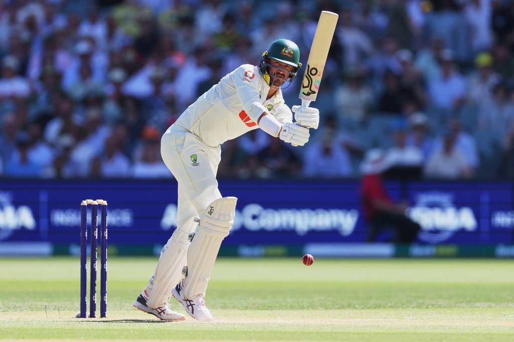 Australia's Mitchell Starc bats during play on day two of the third Ashes cricket test between England and Australia in Adelaide, Australia, Thursday, Dec. 18, 2025. (AP Photo/James Elsby)