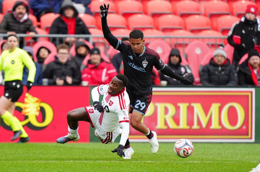Colorado Rapids defender Miguel Navarro (29) picks up a red card after he fouls Toronto FC defender Richie Laryea (22) during the second half of an MLS soccer game in Toronto, Saturday, April 4, 2026. (Frank Gunn/The Canadian Press via AP)