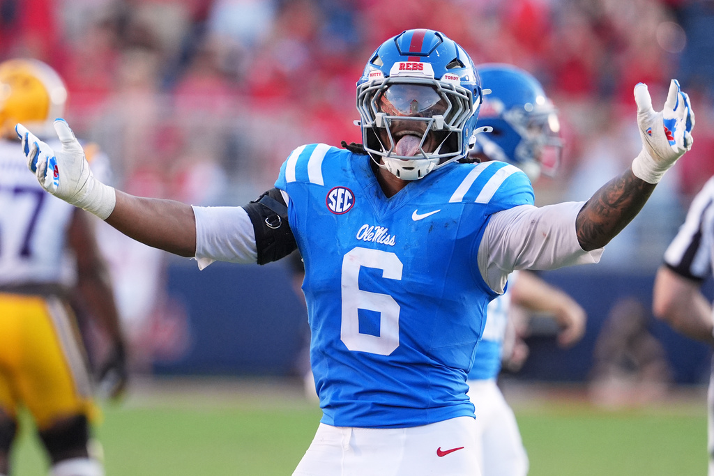 Mississippi linebacker TJ Dottery (6) encourages fan participation during the second half of an NCAA college football game against LSU in Oxford, Miss., Saturday, Sept. 27, 2025. (AP Photo/Rogelio V. Solis)