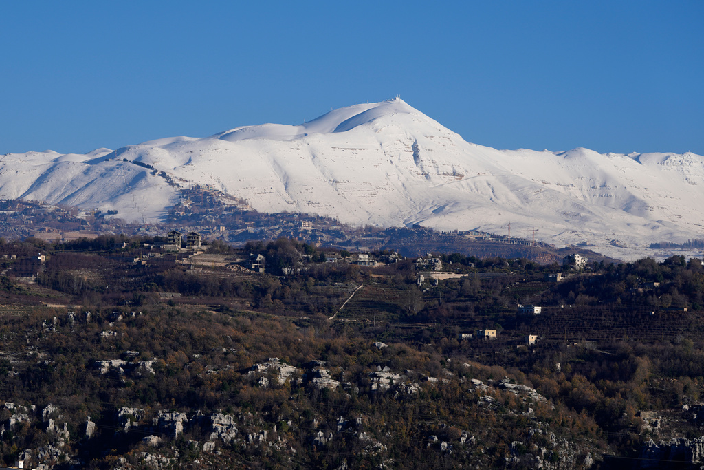Mount Sannine is covered with snow as seen from the village of Faraya, northeast of Beirut, Lebanon, Saturday, Jan. 3, 2026. (AP Photo/Hassan Ammar)