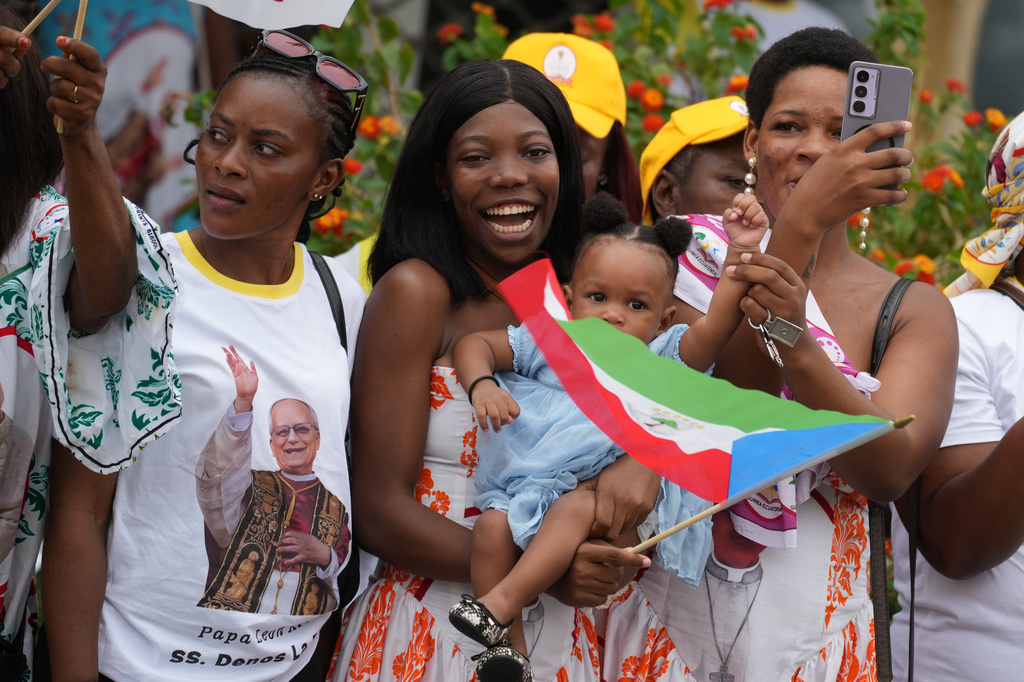 People wait for Pope Leo XIV in Malabo, Equatorial Guinea, Tuesday, April 21, 2026, on the ninth day of his 11-day pastoral visit to Africa. (AP Photo/Andrew Medichini)