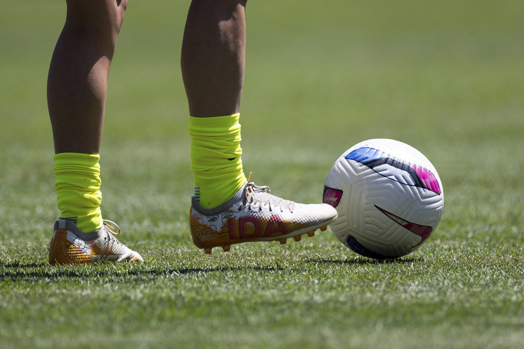 Washington Spirit midfielder Courtney Brown warms up with cleats that read "IDA" before a NWSL soccer match against Bay FC on Saturday, Aug. 23, 2025, in San Francisco. (AP Photo/Benjamin Fanjoy)