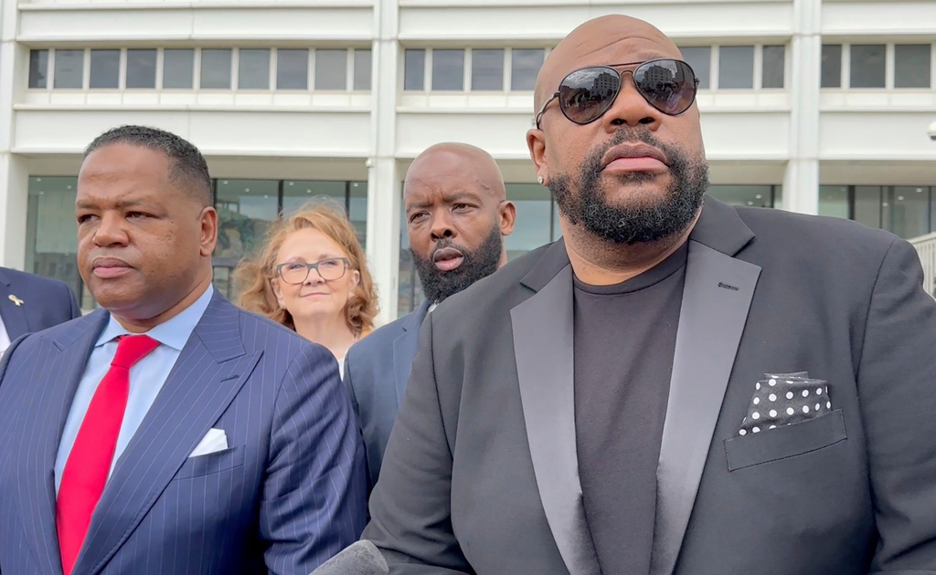 FILE - Isaac Hayes III, right, and his attorney address reporters outside a federal courthouse in Atlanta, Sept. 3, 2024. (AP Photo/Kate Brumback, File)