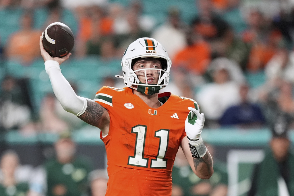 Miami quarterback Carson Beck looks to pass during the second half of an NCAA college football game against South Florida, Saturday, Sept. 13, 2025, in Miami Gardens, Fla. (AP Photo/Rebecca Blackwell)