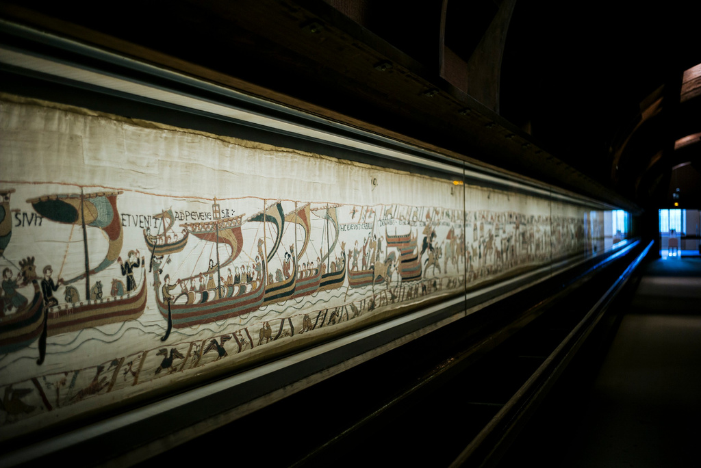 FILE - This photo taken Sept. 18, 2019 shows the 11th century Bayeux tapestry chronicling the Norman conquest of England, in Bayeux, Normandy, France. (AP Photo/Kamil Zihnioglu, File)