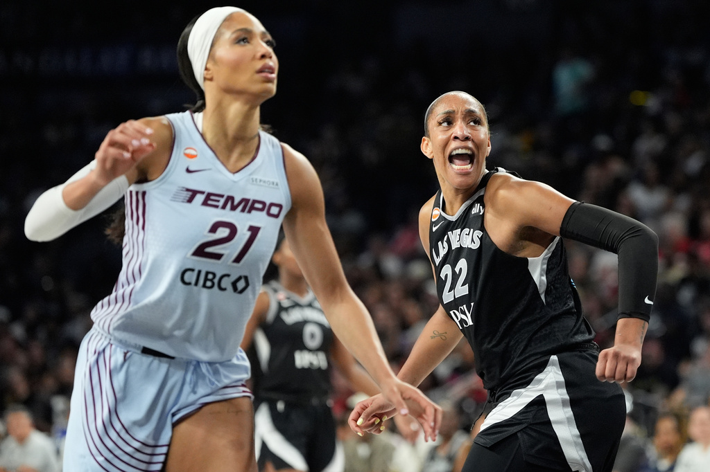 Las Vegas Aces center A'ja Wilson (22) celebrates after a play against the Toronto Tempo during the second half of a WNBA basketball game Friday, Aug. 28, 2026, in Las Vegas. (AP Photo/John Locher)
