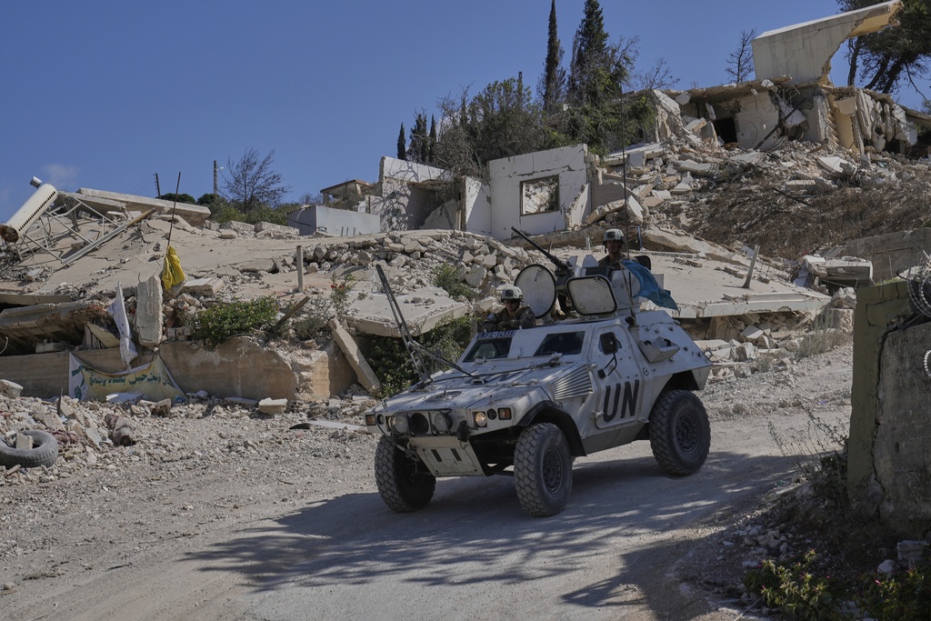 French U.N. peacekeepers patrol the Lebanese-Israeli border in the village of Kfra Kila, southern Lebanon, Wednesday, Aug. 20, 2025. (AP Photo/Hussein Malla)