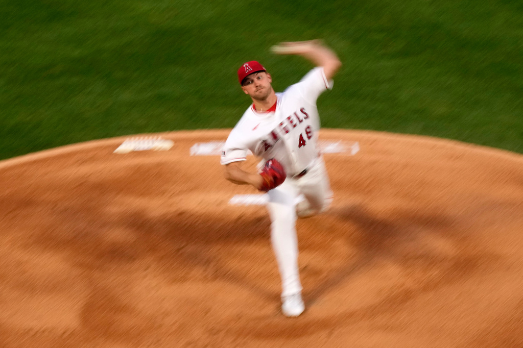 Los Angeles Angels starting pitcher Reid Detmers throws to the plate during the first inning of an opening-day baseball game against the Seattle Mariners, Friday, April 3, 2026, in Anaheim, Calif. (AP Photo/Mark J. Terrill)
