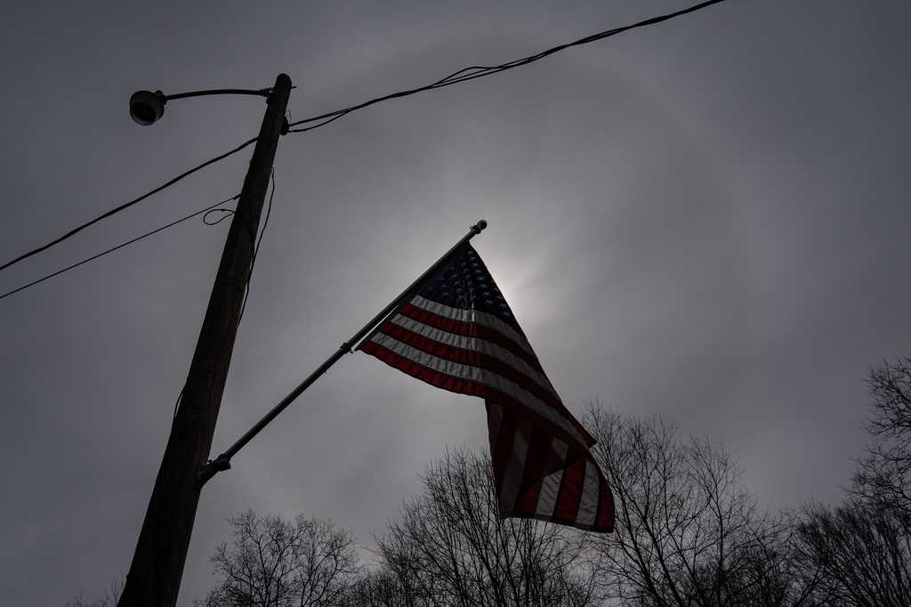 A U.S. flag decorates an electric pole outside Ashley Nicole Dixon's home in Danese, W.Va., Saturday, March 21, 2026. (AP Photo/Carolyn Kaster)