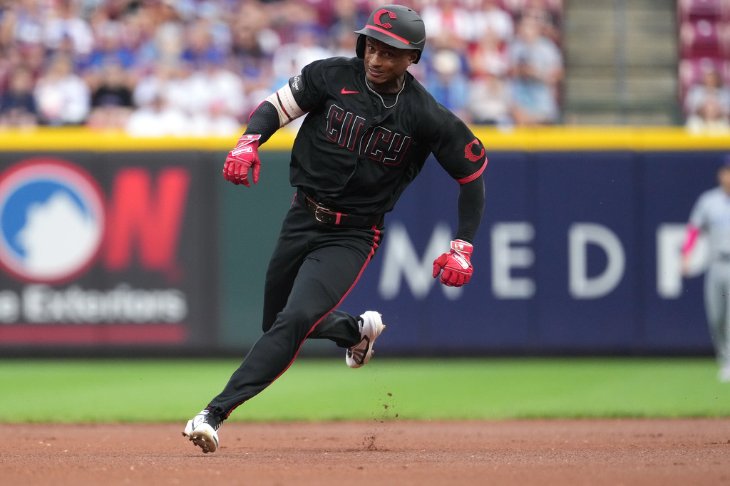 Cincinnati Reds' Carlos Jorge advances to third base after hitting a triple during the first inning of a baseball game against the Chicago Cubs, Friday, Sept. 18, 2026, in Cincinnati. (AP Photo/Kareem Elgazzar)