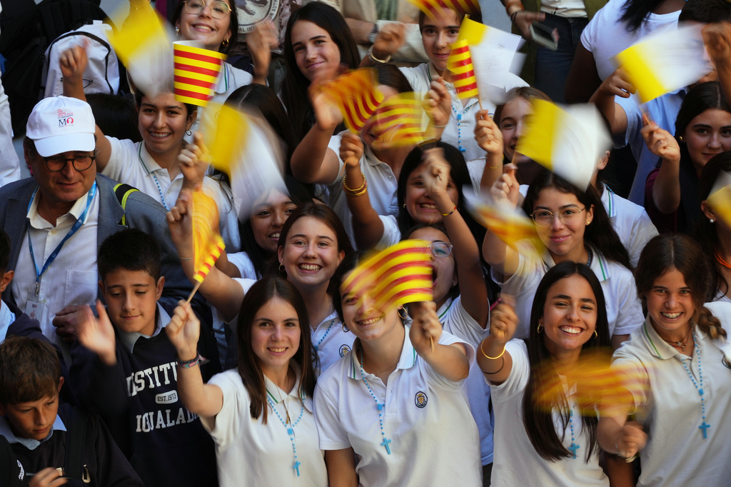 People wait for the arrival of Pope Leo XIV to lead a rosary at the Abbey of Our Lady of Montserrat, in Montserrat, Spain, Wednesday, June 10, 2026. (AP Photo/Alessandra Tarantino)