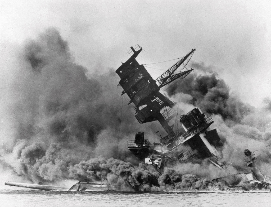 FILE - Smoke rises from the battleship USS Arizona as it sinks during the Japanese attack on Pearl Harbor, Hawaii, Dec. 7, 1941. (AP Photo, File)