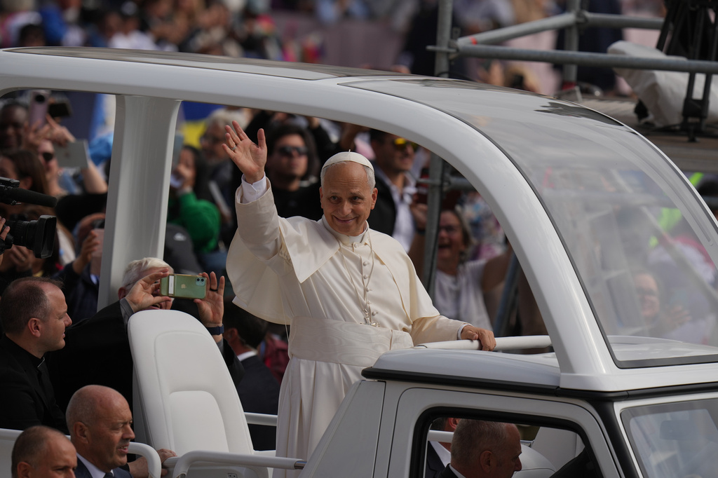 Pope Leo XIV waves from his popemobile at the end of a Mass for the Jubilee of Migrants and Missionaries in St. Peter's Square at the Vatican, Sunday, Oct. 5, 2025. (AP Photo/Alessandra Tarantino)
