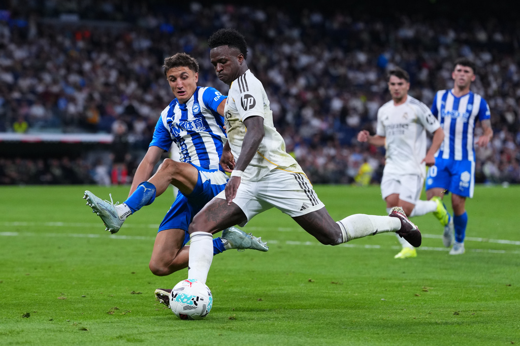FILE - Alaves' Nahuel Tenaglia tries to block Real Madrid's Vinicius Junior during a La Liga soccer match between Real Madrid and Alaves in Madrid, Spain, Tuesday, April 21, 2026. (AP Photo/Manu Fernandez, File)