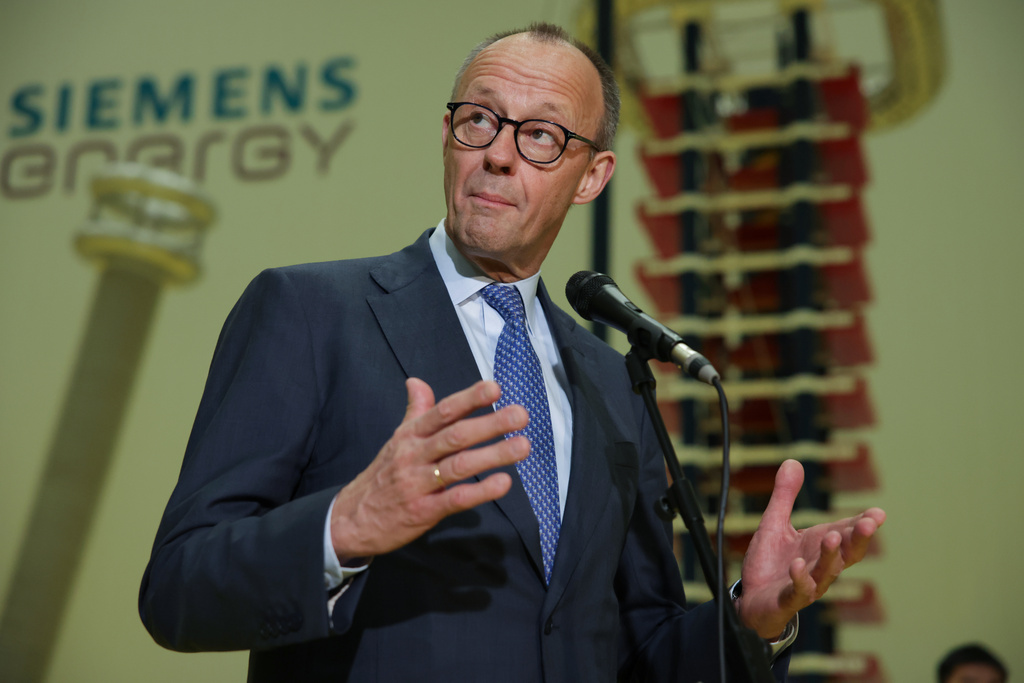 German Chancellor Friedrich Merz speaks before media members as he visits facilities of Siemens Energy during his official visit, in Hangzhou, China, Thursday, Feb. 26, 2026. (Andres Martinez Casares/Pool Photo via AP)