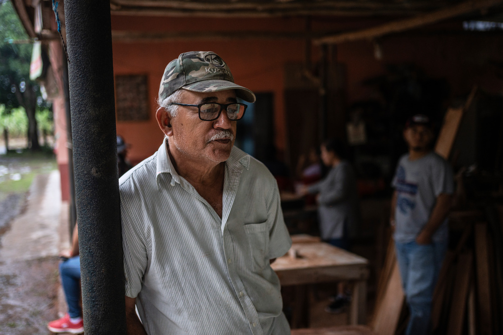 Eduardo Castillo, the father of Lt. Luis Enrique Castillo, a victim of a Mexican Navy plane crash off the Texas coast, gathers with family at their home in El Pantano, Veracruz state, Mexico, Tuesday, Dec. 23, 2025. (AP Photo/Felix Marquez)