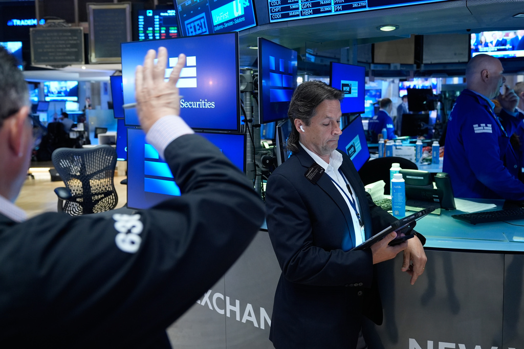 Patrick McKeon works on the floor at the New York Stock Exchange in New York, Monday, July 6, 2026. (AP Photo/Seth Wenig)