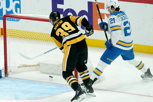 Pittsburgh Penguins' Anthony Mantha (39) scores next to St. Louis Blues' Jimmy Snuggerud (21) during the first period of an NHL hockey game, Monday, Oct. 27, 2025, in Pittsburgh. (AP Photo/Matt Freed) Pittsburgh Penguins' Anthony Mantha (39) scores next to St. Louis Blues' Jimmy Snuggerud (21) during the first period of an NHL hockey game, Monday, Oct. 27, 2025, in Pittsburgh. (AP Photo/Matt Freed)
