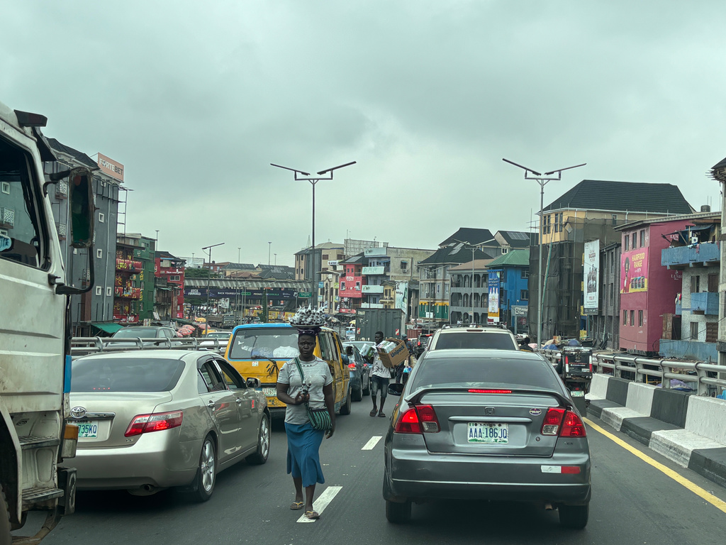 People sell their merchandise during rush hour traffic in Lagos, Nigeria, Tuesday, Aug. 18, 2026. (AP Photo/Sunday Alamba)