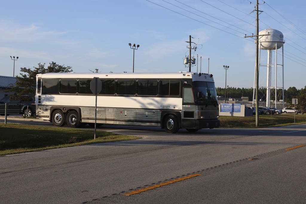 A bus leaves the Folkston Immigration and Customs Enforcement processing center, Wednesday, Sept. 10, 2025, in Folkston, Ga. (AP Photo/Gary McCullough)