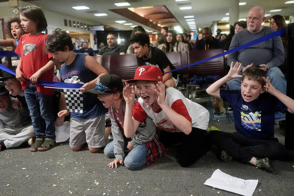 Fans react during a Lucha Libro pro wrestling match at Benicia Public Library Saturday, May 2, 2026, in Benicia, Calif. (AP Photo/Jeff Chiu)