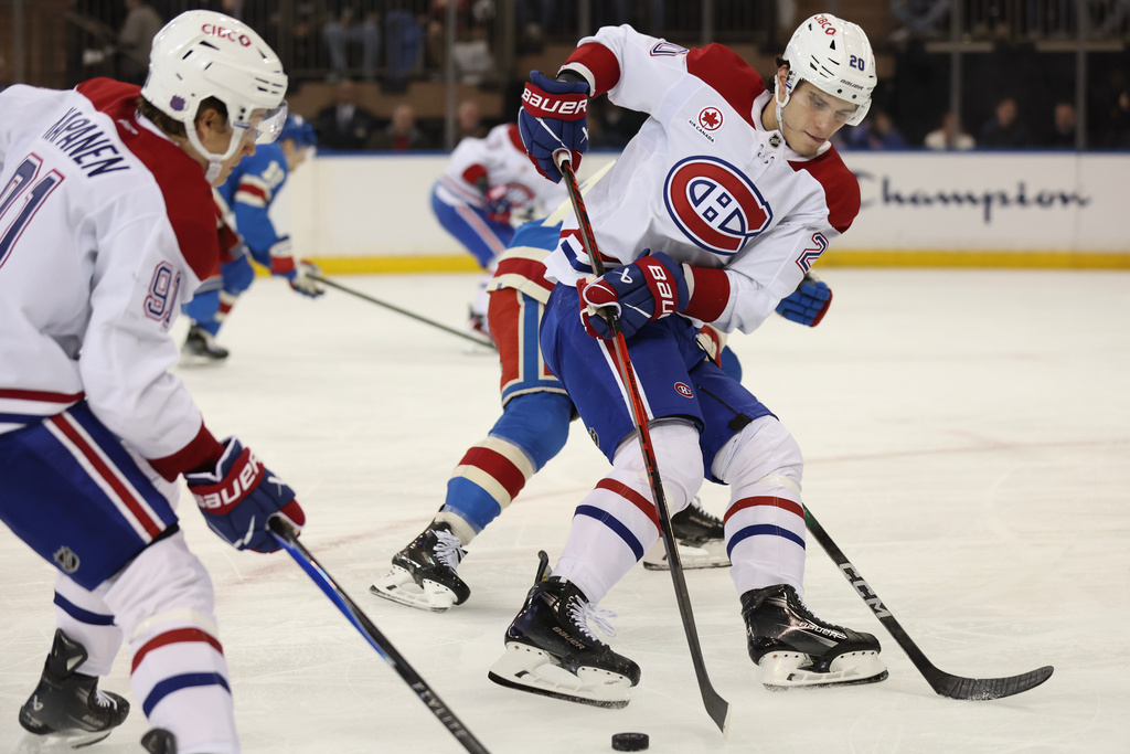 Montréal Canadiens' Juraj Slafkovský (20) looks to pass the puck during the second period of an NHL hockey game against the New York Rangers, Saturday, Dec. 13, 2025, in New York. (AP Photo/Heather Khalifa)