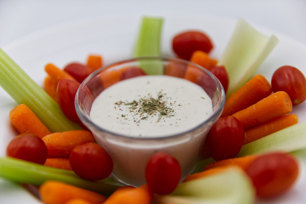 Ranch dressing is served with raw vegetables in Phoenix, Monday, April 13, 2026. (AP Photo/Dario Lopez-Mills)