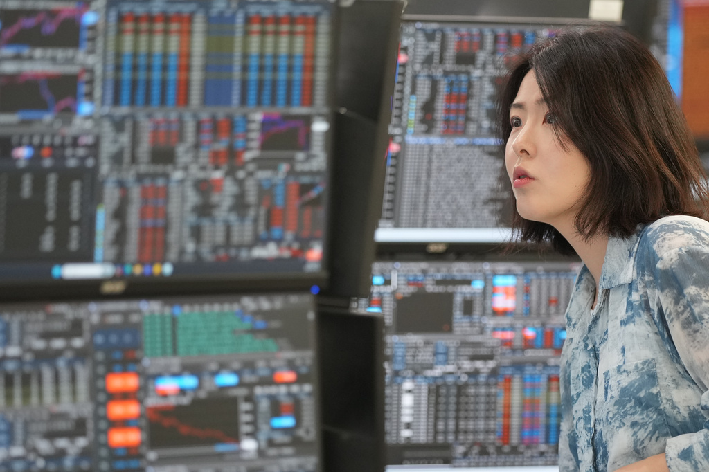 A dealer watches computer monitors at a dealing room of Hana Bank in Seoul, South Korea, Wednesday, May 6, 2026. (AP Photo/Lee Jin-man)