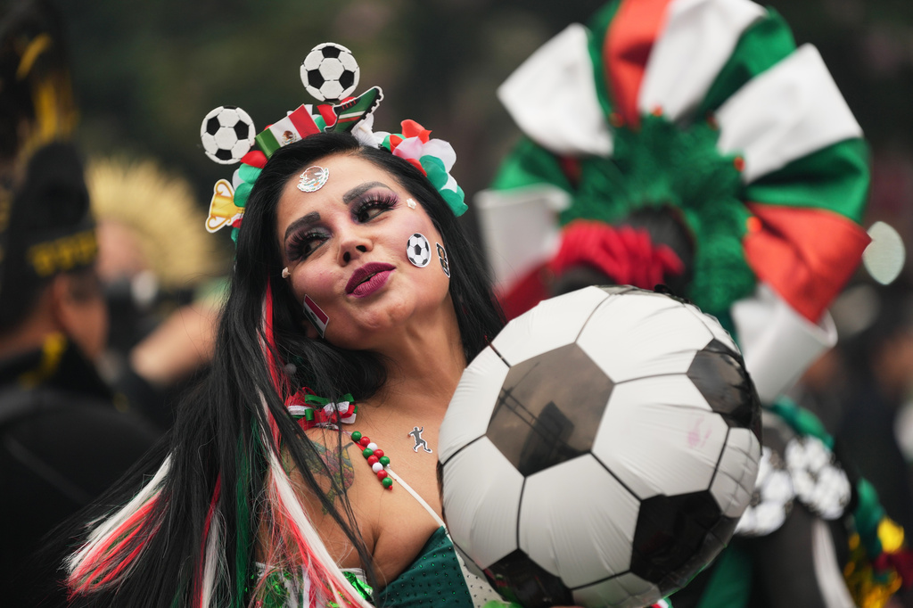 A dancer performs along Reforma Avenue in Mexico City, Saturday, June 6, 2026 ahead of the FIFA World Cup. (AP Photo/Moises Castillo)