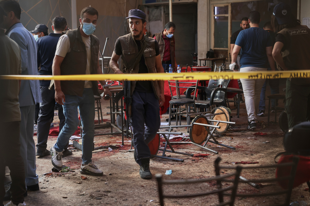 Syrian security inspects the site after an explosive device was detonated in a cafe near the main courthouse complex, in Damascus, Syria, Thursday, July 2, 2026 (AP Photo/Ghaith Alsayed)