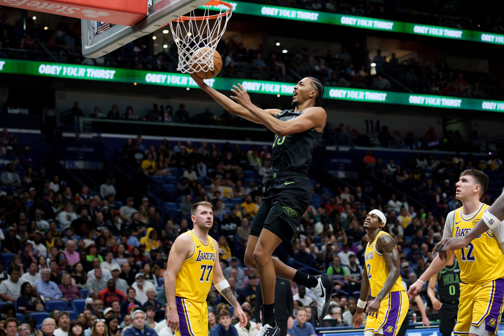 New Orleans Pelicans forward Trey Murphy III makes a basket against the Los Angeles Lakers during the first half of an NBA basketball game in New Orleans, Tuesday, Jan. 6, 2026. (AP Photo/Matthew Hinton)