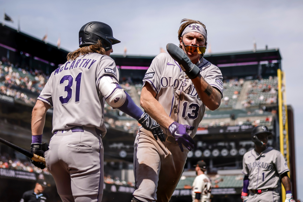 Colorado Rockies' Zac Veen (13) celebrates after he scored on a wild pitch in the sixth inning of a baseball game against the San Francisco Giants in San Francisco, Sunday, Aug. 16, 2026. (Carlos Avila Gonzalez/San Francisco Chronicle via AP) CORRECTION: Corrects to Zac Veen not Zack Veen.