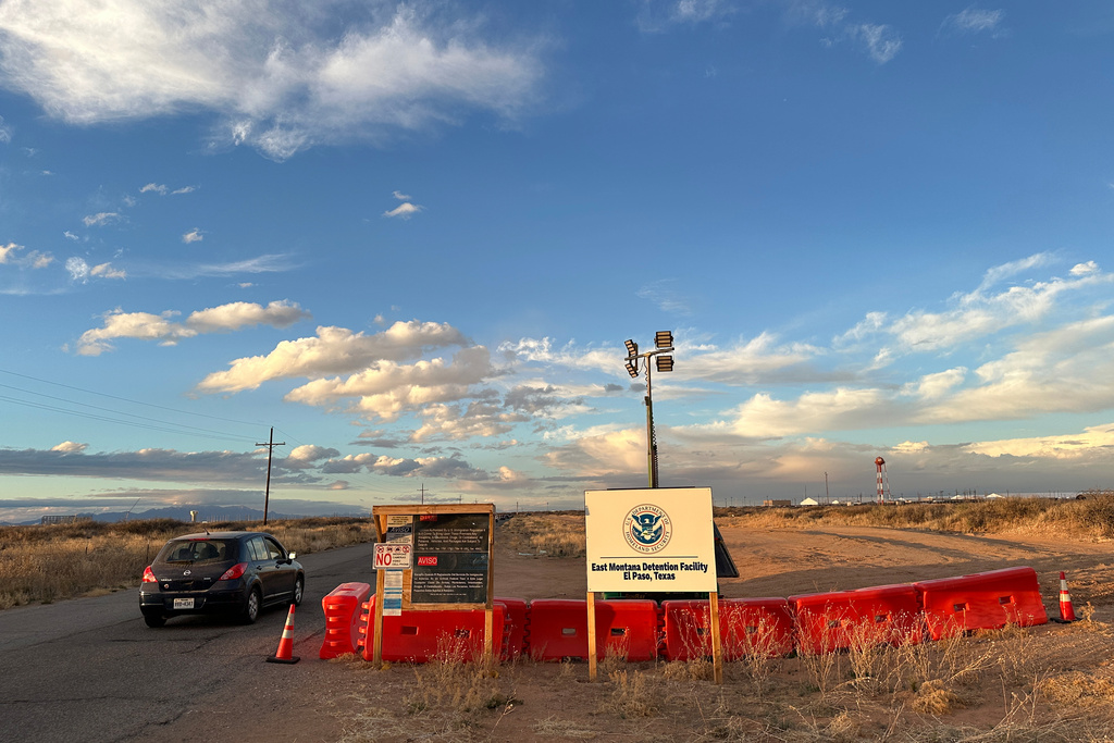 A sign marks the entrance to a series of hardened tents at the Camp East Montana immigrant detention center in the desert at a U.S. Army base on the outskirts of El Paso, Texas, Friday, Feb. 13, 2026. (AP Photo/Morgan Lee)
