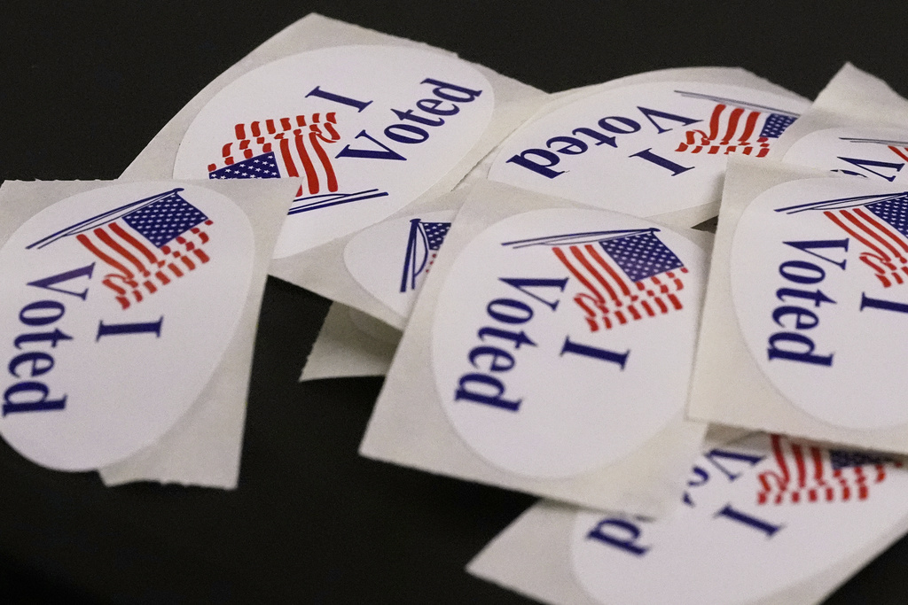 "I Voted" stickers rest on a ballot box at a polling place, Tuesday, Sept. 9, 2025, in the Roslindale neighborhood of Boston. (AP Photo/Charles Krupa)