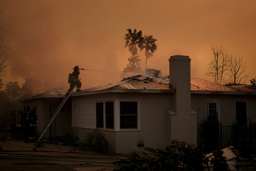Fire crews battle the Eaton Fire as it impacts a structure Thursday, Jan. 9, 2025 in Altadena, Calif. (AP Photo/Eric Thayer) Fire crews battle the Eaton Fire as it impacts a structure Thursday, Jan. 9, 2025 in Altadena, Calif. (AP Photo/Eric Thayer)