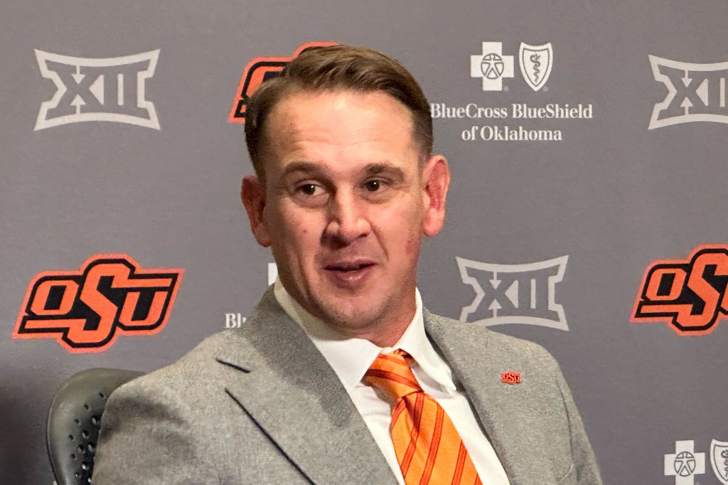 FILE - Eric Morris attends a news conference introducing him as the new head coach of the Oklahoma State NCAA college football team, Dec. 8, 2025 in Stillwater, Okla.(AP Photo/Cliff Brunt, File)