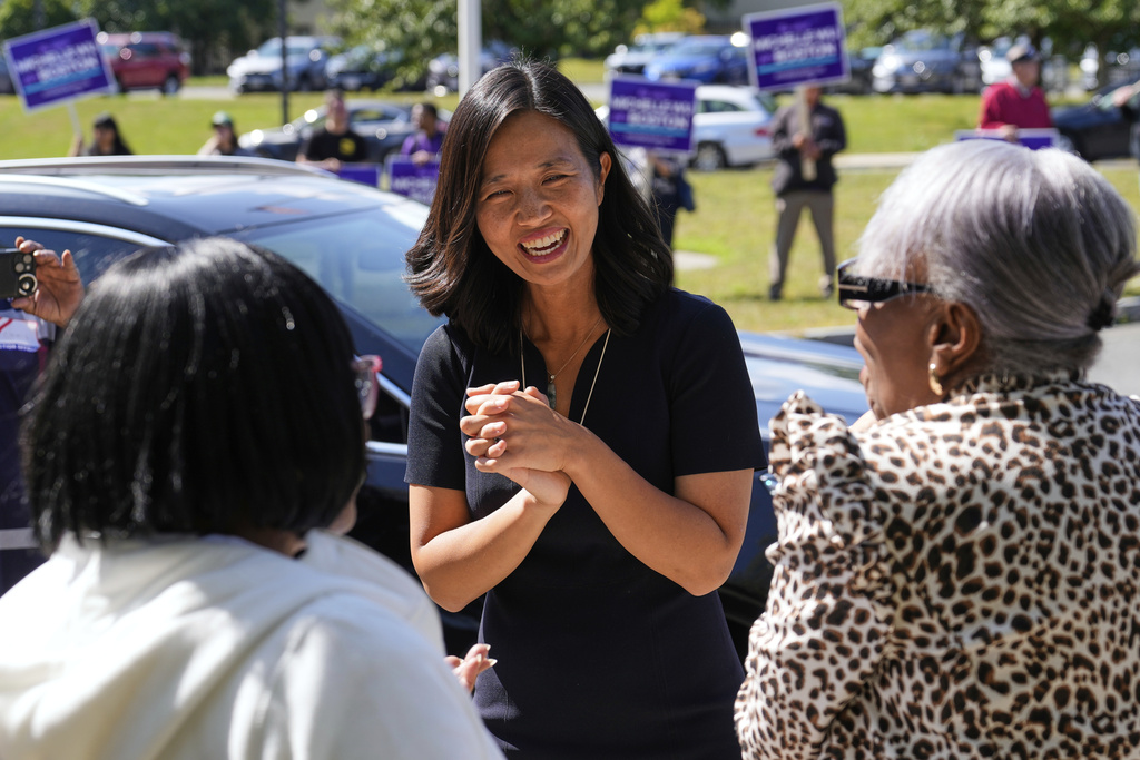 Boston Mayor Michelle Wu chats with voters at a polling place, Tuesday, Sept. 9, 2025, in the Dorchester neighborhood of Boston. (AP Photo/Charles Krupa)