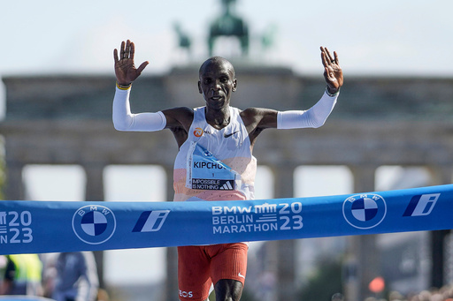 FILE - Kenya's Eliud Kipchoge crosses the line to win the men's division of the Berlin Marathon in Berlin, Germany, Sunday, Sept. 24, 2023. (AP Photo/Markus Schreiber, FILE_ FILE - Kenya's Eliud Kipchoge crosses the line to win the men's division of the Berlin Marathon in Berlin, Germany, Sunday, Sept. 24, 2023. (AP Photo/Markus Schreiber, FILE_