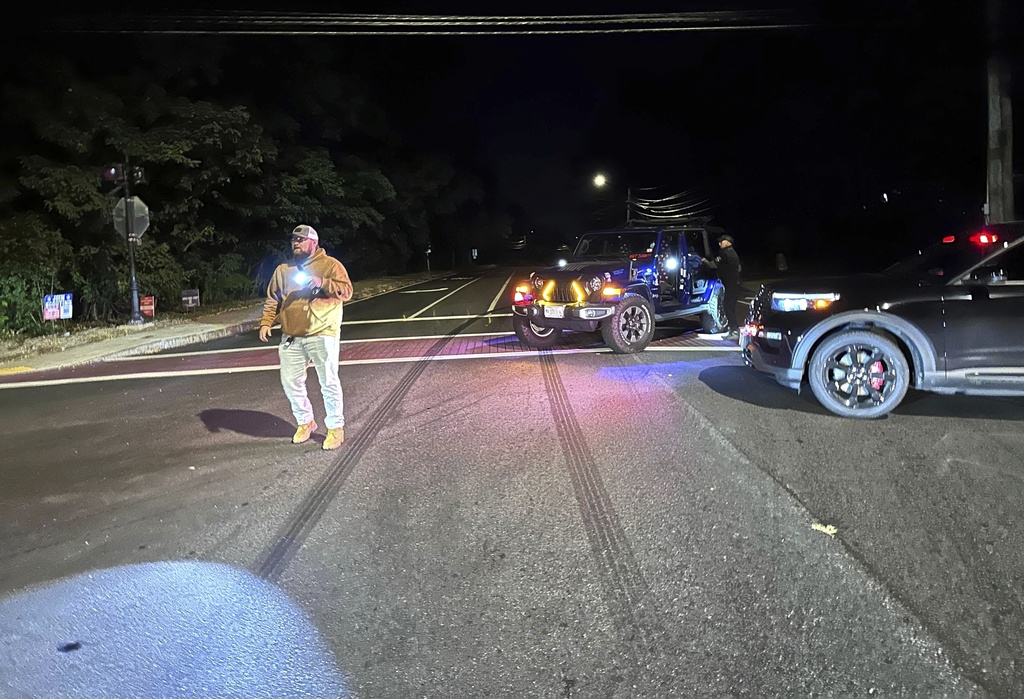 Police block a road to a country club where a shooting happened at Sky Meadow Country Club in Nashua, New Hampshire, Saturday, Sept. 20, 2025. (AP Photo/Michael Casey)