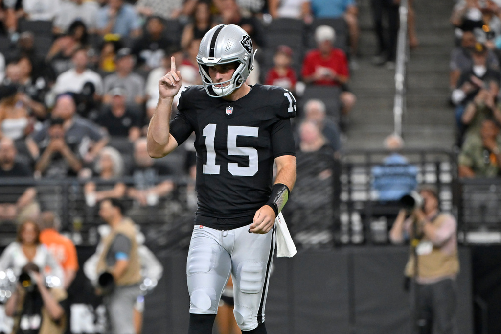 Las Vegas Raiders quarterback Fernando Mendoza (15) pauses on the field during the first half of a preseason NFL football game against the Arizona Cardinals, Thursday, Aug. 13, 2026, in Las Vegas. (AP Photo/David Becker)