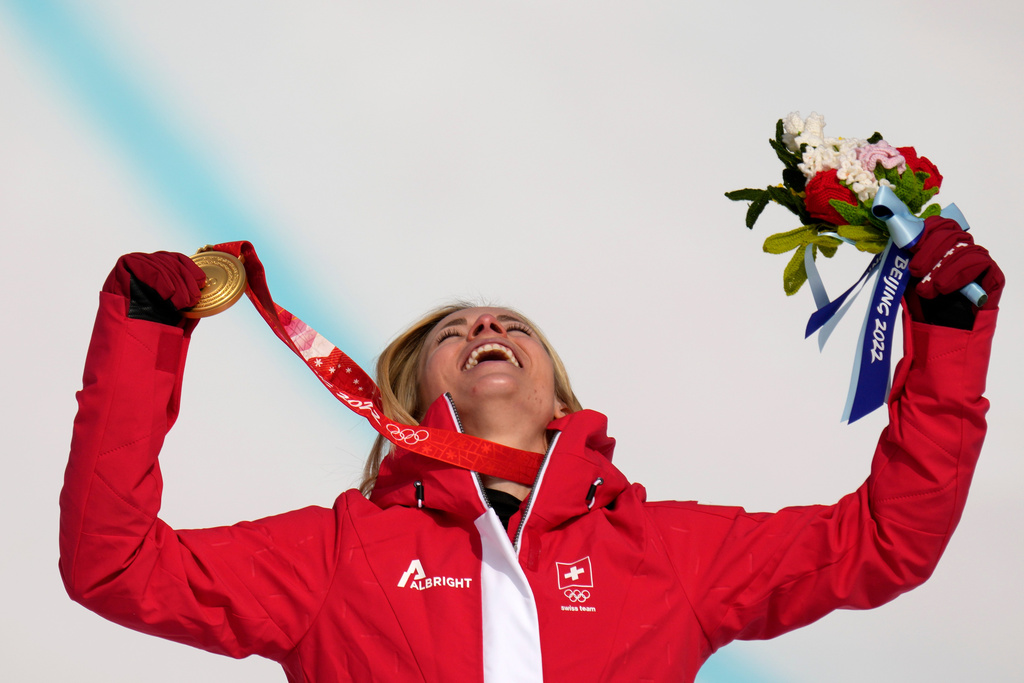FILE - Lara Gut-Behrami, of Switzerland celebrates during the medal ceremony after winning the gold medal in the women's super-G at the 2022 Winter Olympics, Friday, Feb. 11, 2022, in the Yanqing district of Beijing. (AP Photo/Luca Bruno, File)