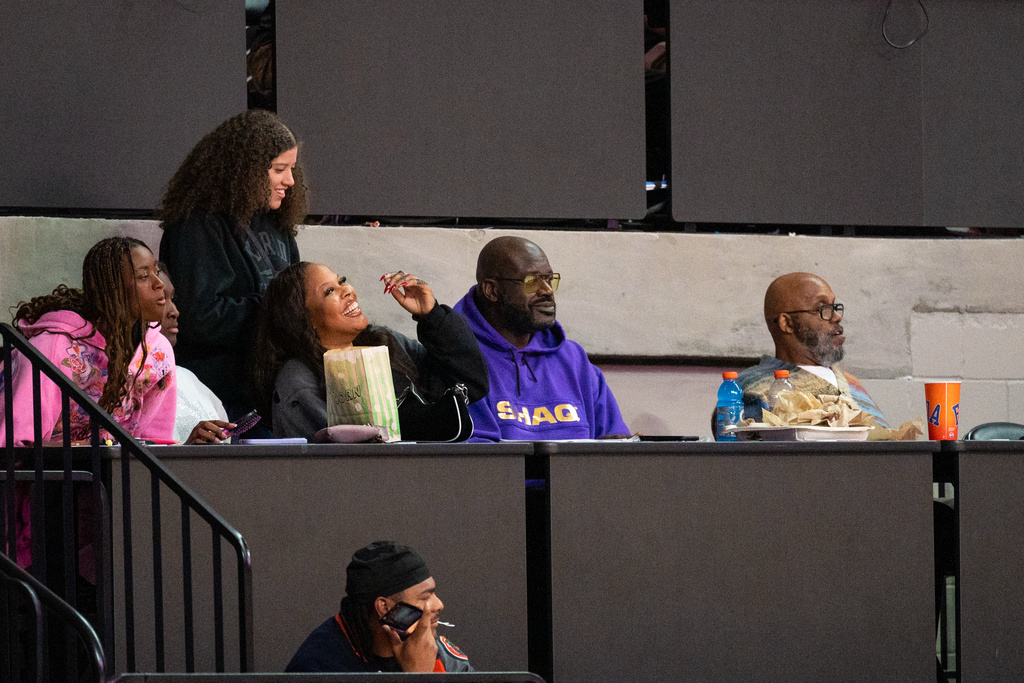 Former NBA player Shaquille O'Neal, second from top right, father of Florida forward Me'Arah O'Neal, watches the first half of an NCAA college basketball game against Texas, Thursday, Jan. 29, 2026, in Gainesville, Fla. (AP Photo/Noah Lantor)