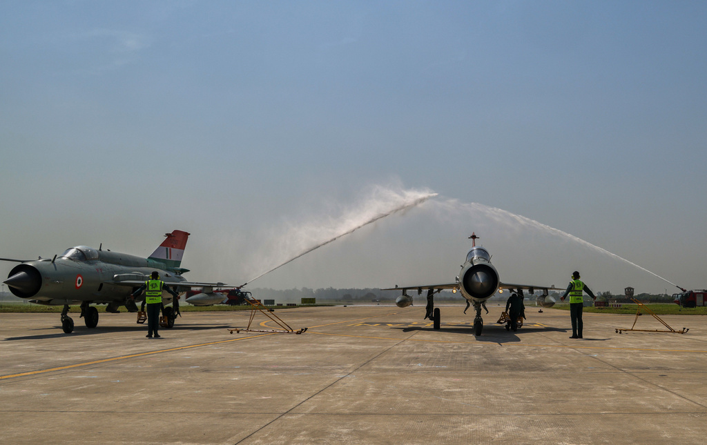 Water jets spray as last fleet of Soviet-era MiG-21 Indian fighter jet rolls in after its flight during a decommissioning ceremony at the Chandigarh Air Force station, India, Friday, Sept. 26, 2025. (AP Photo)